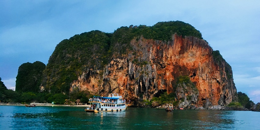 View of tourist enjoying a cruise ride in near the popular Phi Phi Islands in Thailand