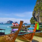 A view of boats lined up on the seashore of picturesque Phra Nang Beach in Thailand.