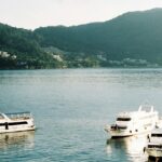 A view of ships cruising the waters offering picturesque views of the surroundings.