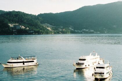 A view of ships cruising the waters offering picturesque views of the surroundings.