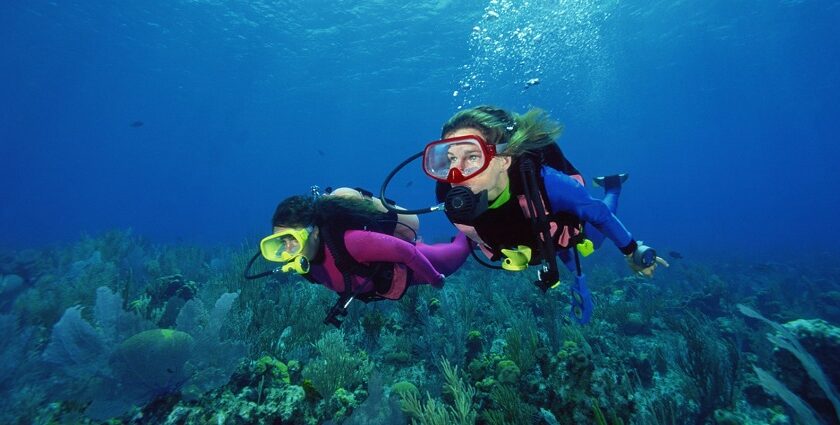 A picture scuba divers enjoying the depths of water in Phuket