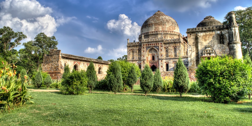 A historical monument surrounded by lush green compounds at a park in Delhi
