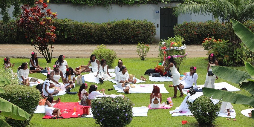People sitting in groups enjoying a sunny day