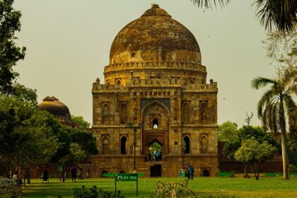 A stunning view of a historical monument surrounded by lush green trees during the day.