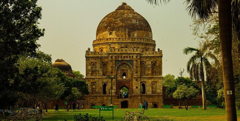 A stunning view of a historical monument surrounded by lush green trees during the day.