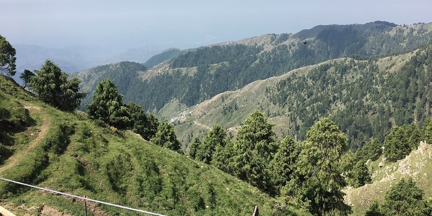 Scenic view of a verdant valley offering thrilling trails for tourists to trek through