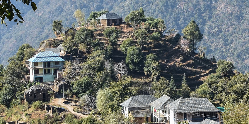 Image of a village around the hill and top of the hills - best places to visit in Kangra valley