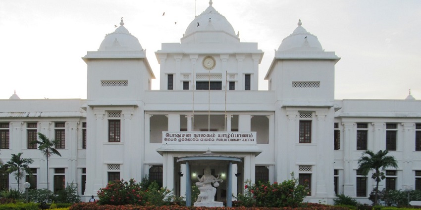A view of the Jaffna Public Library, showcasing its grand architecture and surroundings.