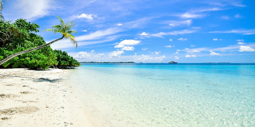 A breathtaking vista of Pulau Kendi Beach featuring crystal clear waters and sand.