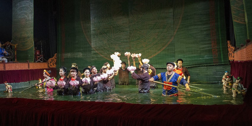 A final act of a popular water show at the Thang Long Puppet Theatre featuring artists.