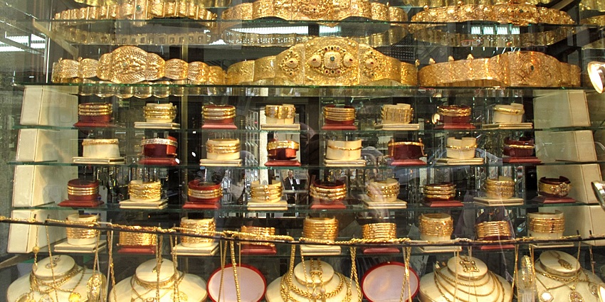 A window display at Pure Gold Jewellers, one of the places for gold shopping in Dubai.