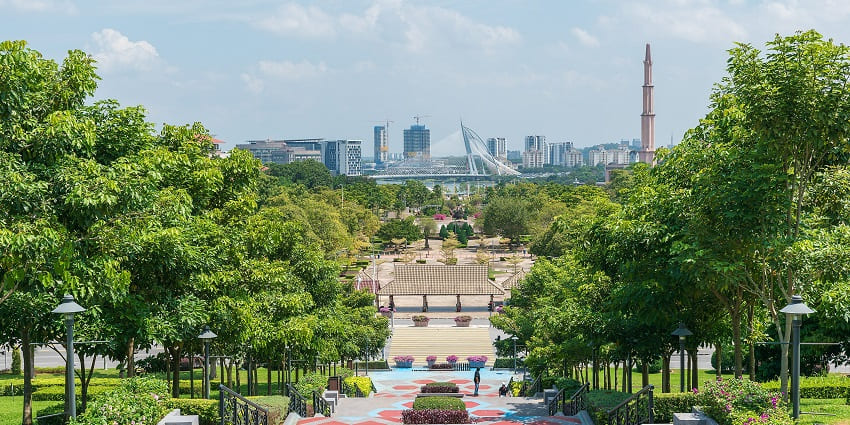 A picture of a majestic garden near Kuala Lumpur with views of the stunning skyline