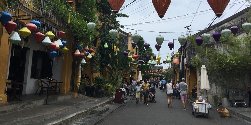 Hoi An nightlife: Nguyen Thai Hoc Street bustling with vibrant lights and evening activity.