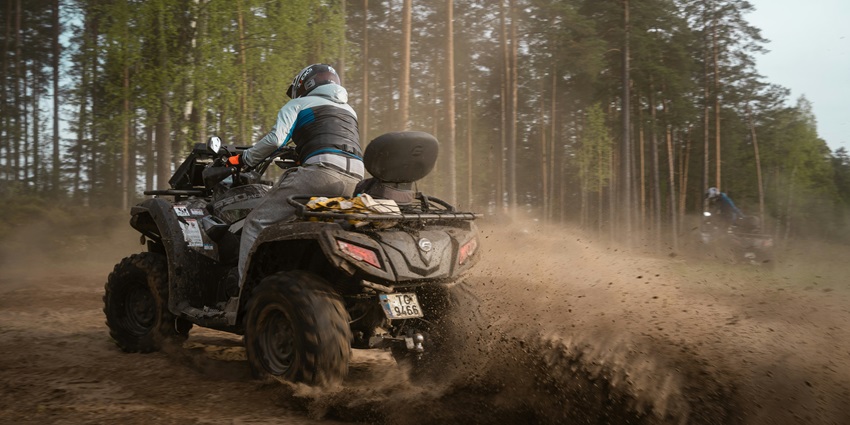 A view of a person driving an ATV, a thrilling activity to try in Solang Valley in April.
