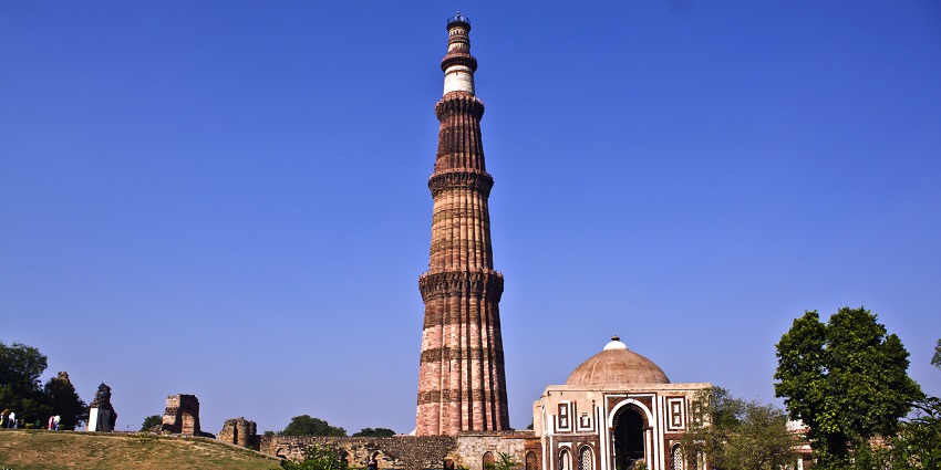 Witness the stunning architecture of Qutub Minar on your trip to New Delhi, India.