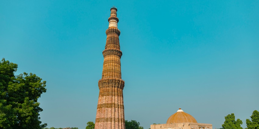 A scenic view of the towering Qutub Minar elegantly standing in the region of Delhi.