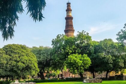 A picture of Qutub Minar showing the majestic tower and nearby attractions