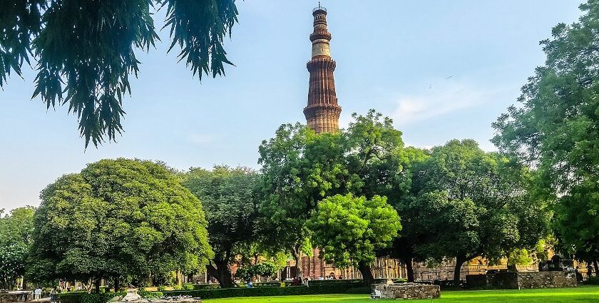 A picture of Qutub Minar showing the majestic tower and nearby attractions