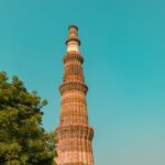 A glimpse of the towering Qutub Minar, a popular tourist attraction of the region.