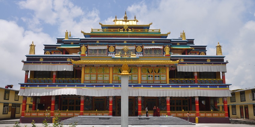 A frontal view of a tall monastery in Sikkim