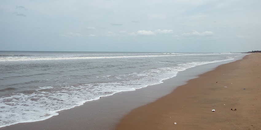 Serene Mypadu Beach with gentle waves, perfect for a relaxing visit.