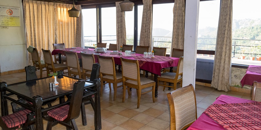 Image from the inside of a Eatery of a restaurant in the hills of the himalachal