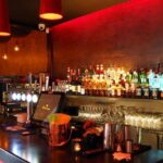 A picture of a bar counter with drinks