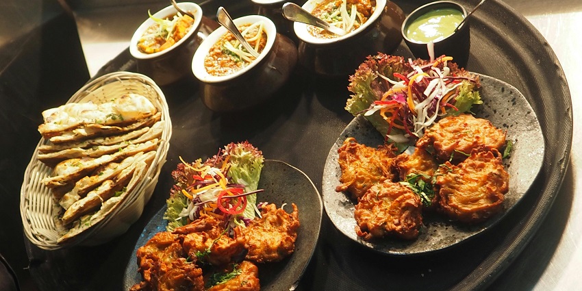 A picture of a restaurant table in Shillong with delicious food placed at display