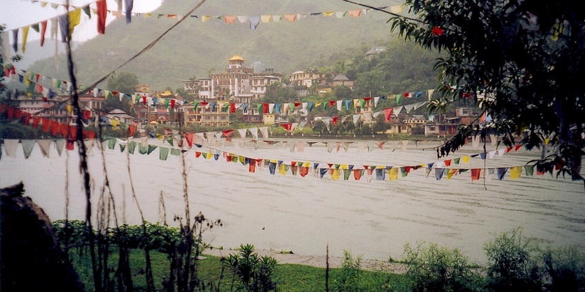 A mesmerising view of Rewalsar Lake in Mandi with flags hanging all around the lake.