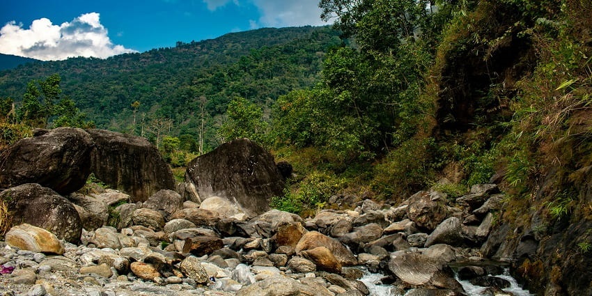 Water flowing through the giant rocks and merging with the gushing stream in Rimbick.