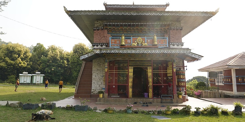 Rinchenpong Monastery showcasing traditional Sikkimese architecture amidst lush greenery.