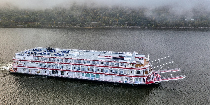 River cruise boat gliding along calm waters - Places to visit in Guwahati for couples.
