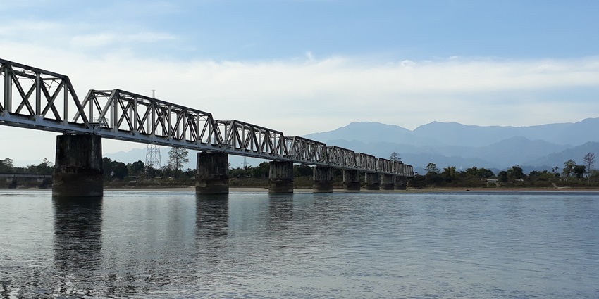 Serene river flowing through Lakhimpur district, surrounded by lush green landscapes.