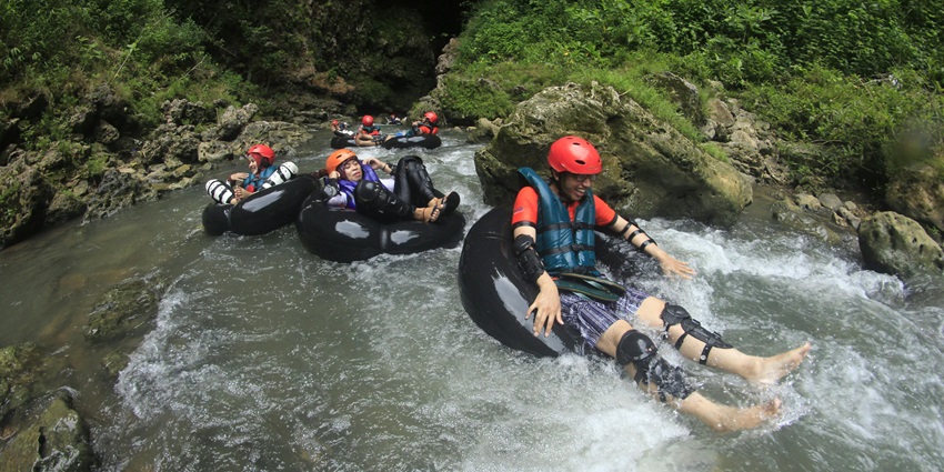 -Group of people indulging in solo quasi river rafting into the wilderness of Arunachal
