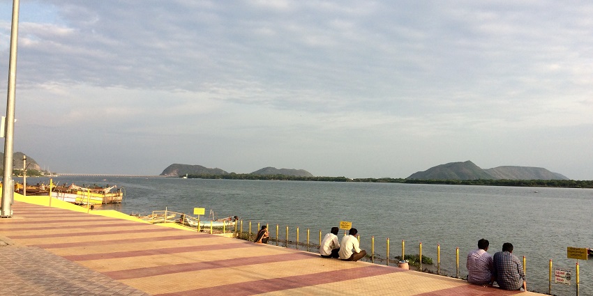 Scenic view of the RiverFront in Gollapudi, showcasing lush greenery and calm waters.