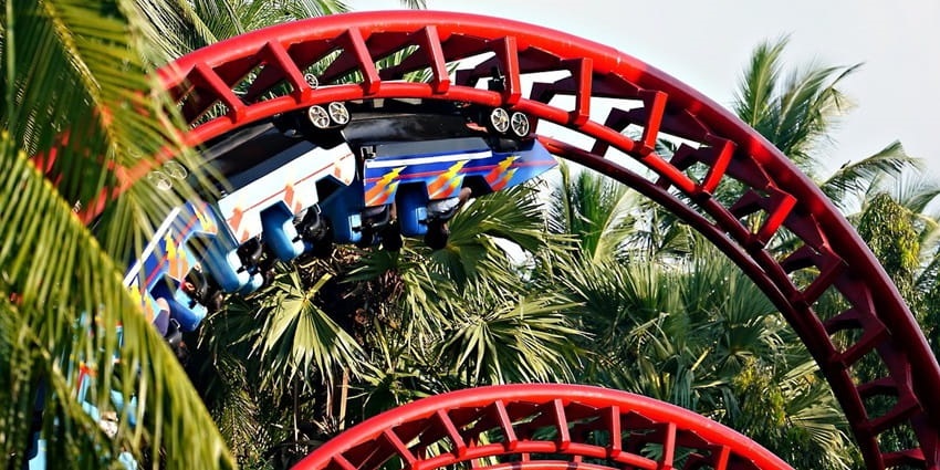 Snapshot of the enthralling roller coaster ride amdist the beautiful surrounding of Theme park