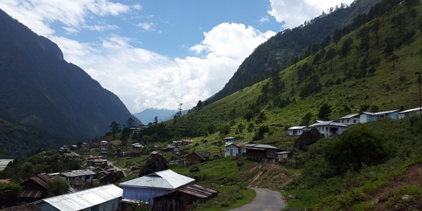 Image of a village in Arunachal Pradesh with picturesque mountains and serene view