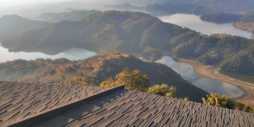 An aerial picture of 2 lakes in Arunachal Pradesh, divided by lush green land
