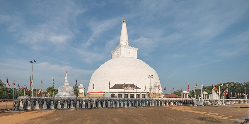 View of the Ruwanwelisaya Stupa in Anuradhapura, showcasing its majestic dome.