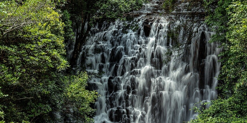 Silver water cascading down the rocks, forming a picturesque sight worth capturing