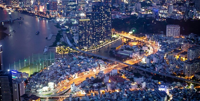 A breathtaking view of Saigon skyline from above under different lights during the night.