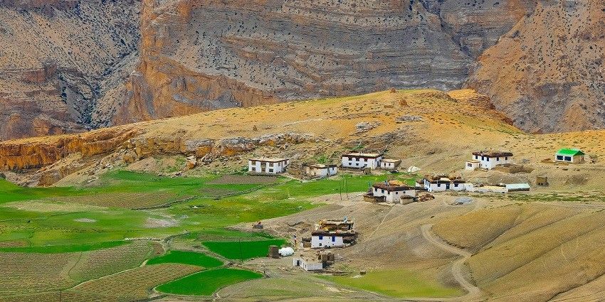 A breathtaking view of lush greenery and a small village in the region of Sakhinetipalli.
