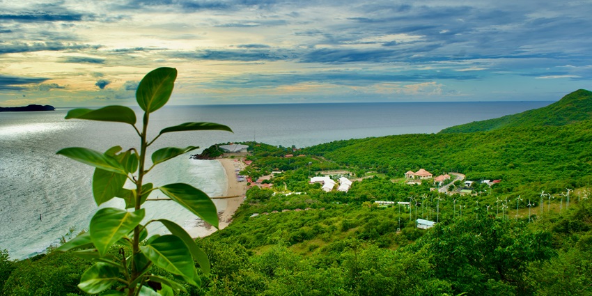 Tranquil Samae Beach with clear turquoise waters, soft sand, and tropical surroundings.