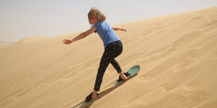 Sandboarding allows you to sway along the slopes of the dunes on a board and experience adventure.