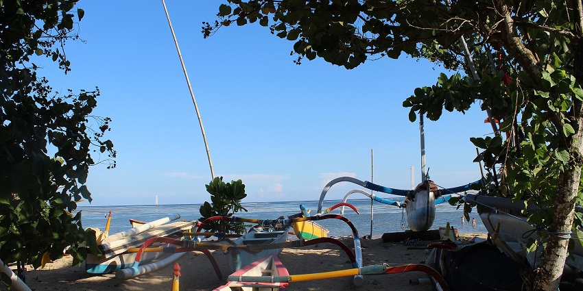 Enchanting views of the Sanur beach side amidst the palm trees and sandy shore