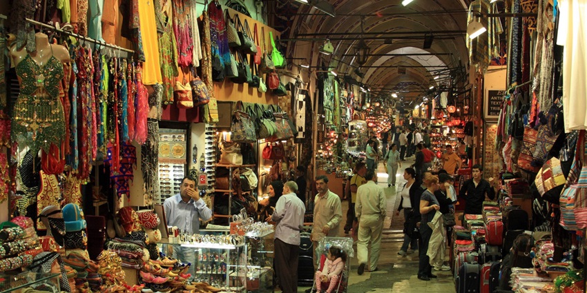 Grand Bazaar shop with colourful textiles, lamps, and traditional market displays.