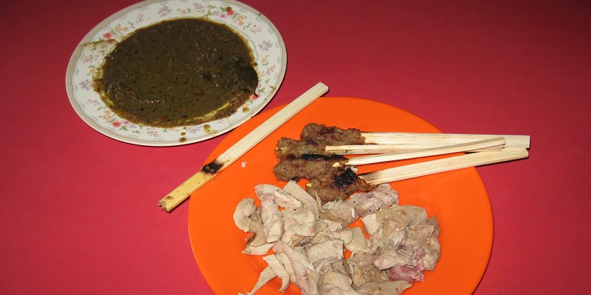 A picture of a dish placed on a table with a red background