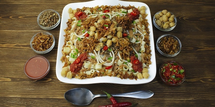 Traditional Egyptian dish Koshary, showcasing a mix of lentils, rice, and pasta.