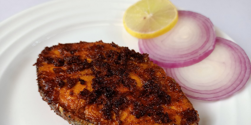 Enjoy delectable seafood like fish fry at eateries near Neer Veezhcha Waterfalls in Kerala