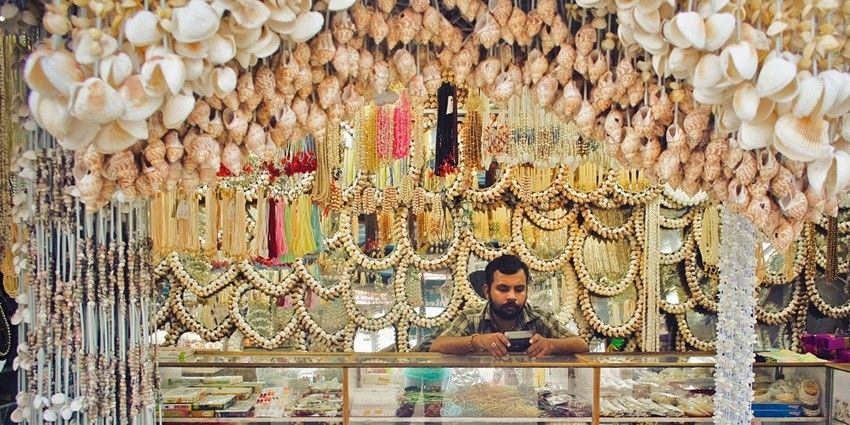 Beautiful seashell jewlery display on a shop, showcasing the creative craftsmanship of the sellers